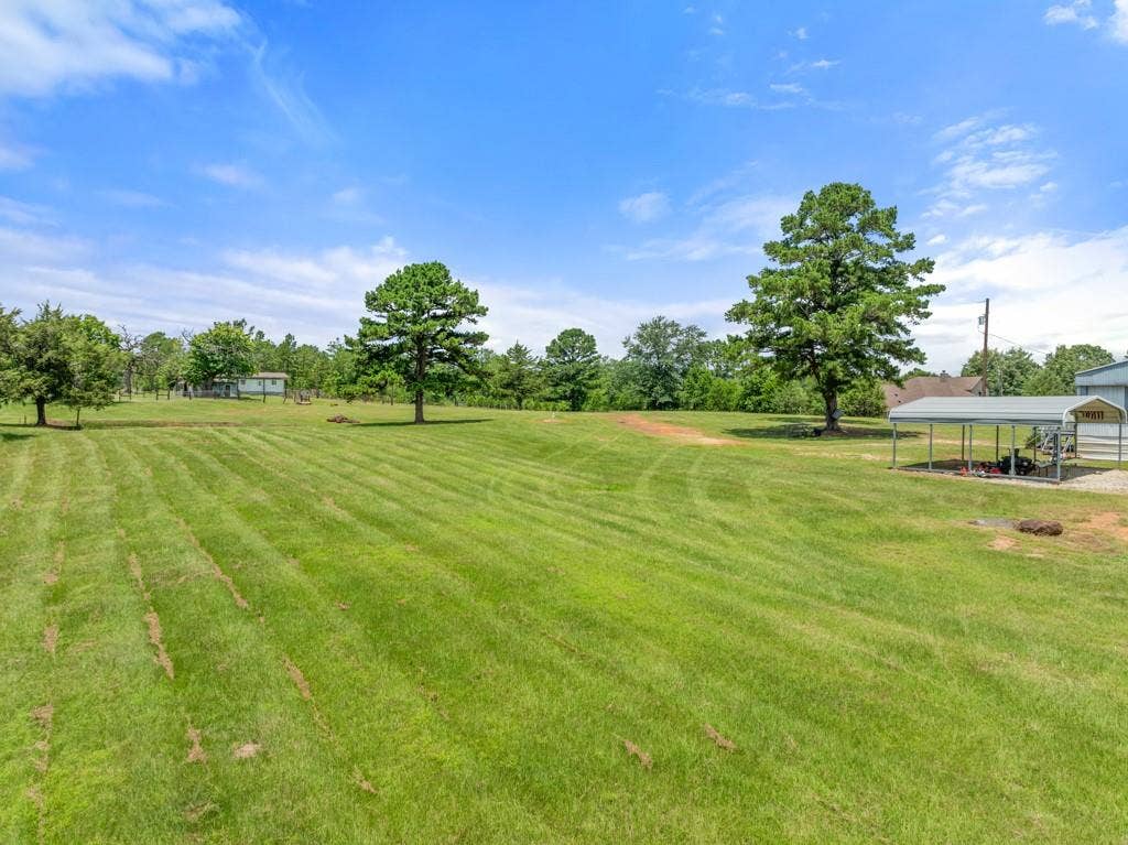 5353 CR 385, Tyler, TX 75708 View of grassy yard featuring a carport