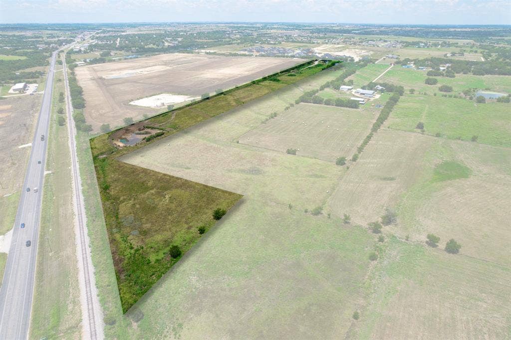1032 #2 E Godley Avenue, Godley, TX 76044 Aerial overview of property's location with rural landscape and large plots for crops