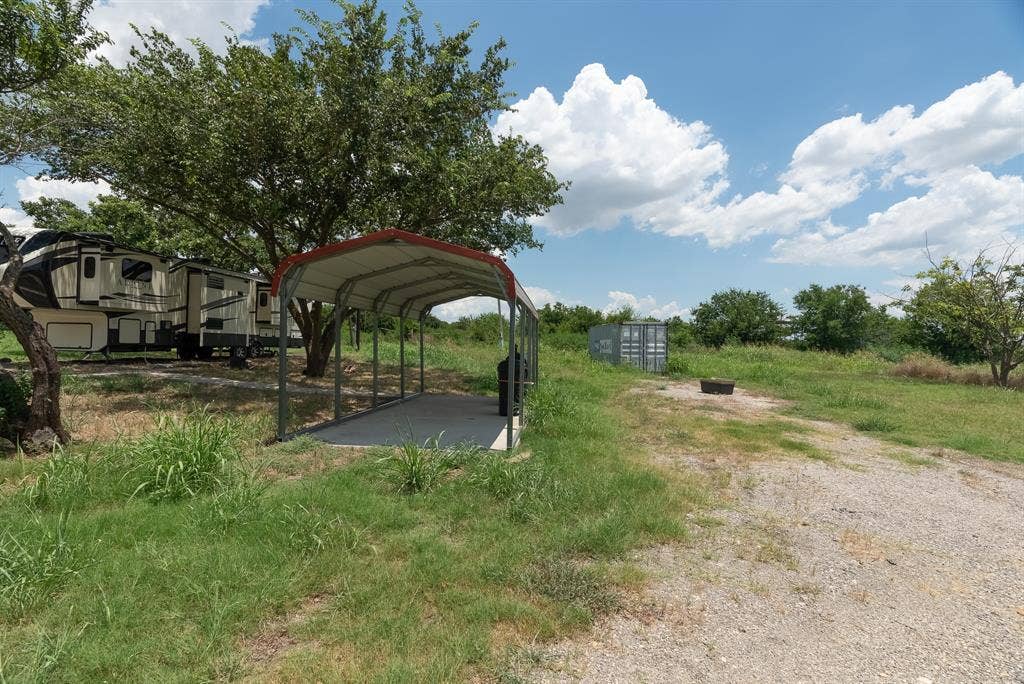 1032 #2 E Godley Avenue, Godley, TX 76044 View of yard with a carport