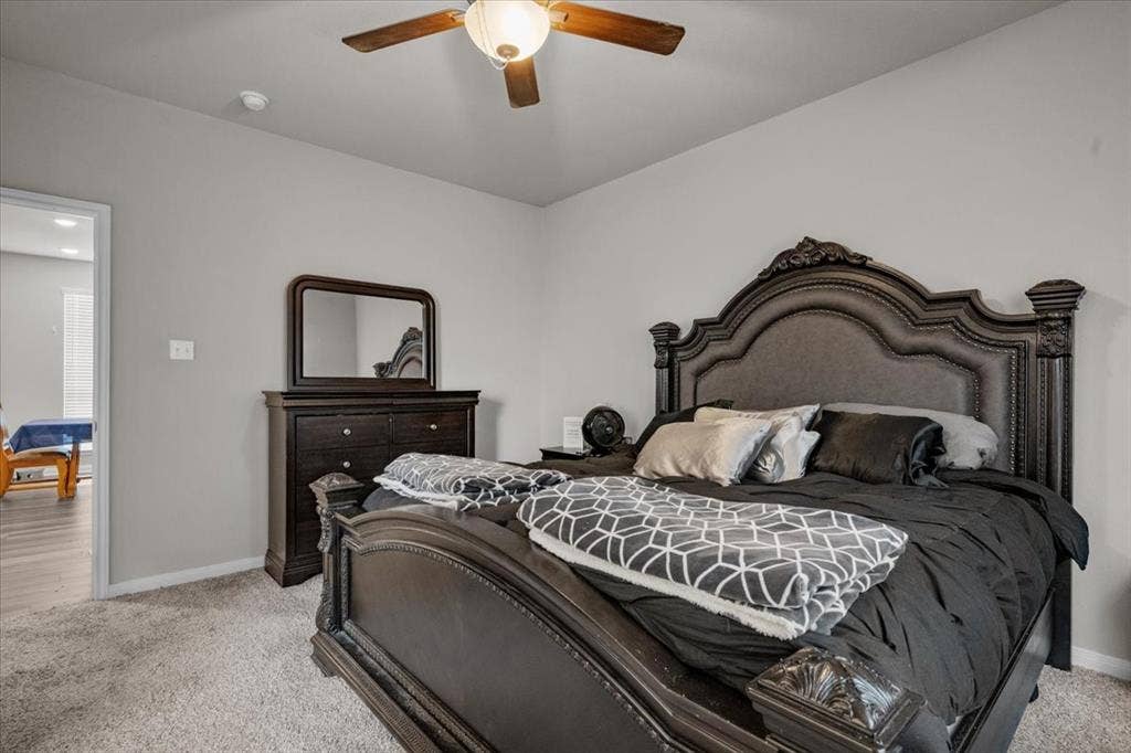 3501 Beutel Road, Waco, TX 76655 Bedroom featuring light colored carpet and a ceiling fan