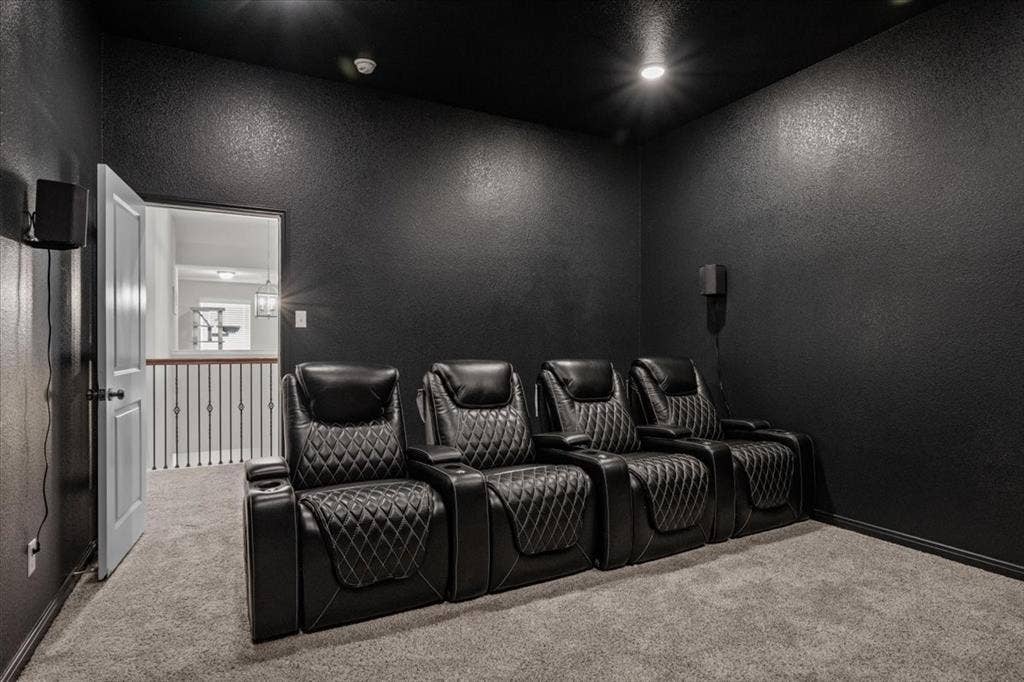 3501 Beutel Road, Waco, TX 76655 Home theater room featuring carpet flooring and a textured wall
