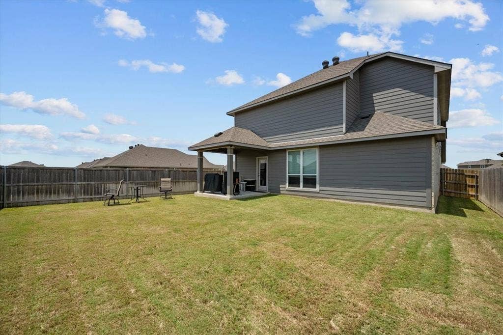 3501 Beutel Road, Waco, TX 76655 Back of house with roof with shingles, a fenced backyard, and a patio area