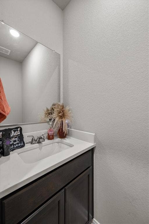 3501 Beutel Road, Waco, TX 76655 Bathroom with a textured wall and vanity