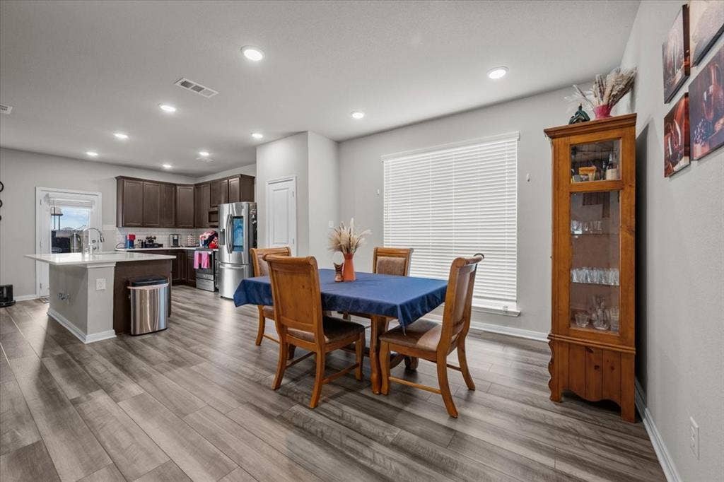 3501 Beutel Road, Waco, TX 76655 Dining area featuring wood finished floors and recessed lighting