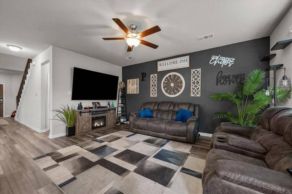 3501 Beutel Road, Waco, TX 76655 Living area with stairway, wood finished floors, and ceiling fan