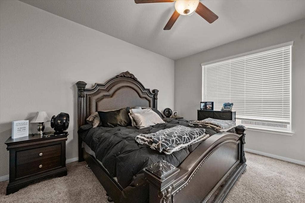 3501 Beutel Road, Waco, TX 76655 Carpeted bedroom featuring baseboards and a ceiling fan