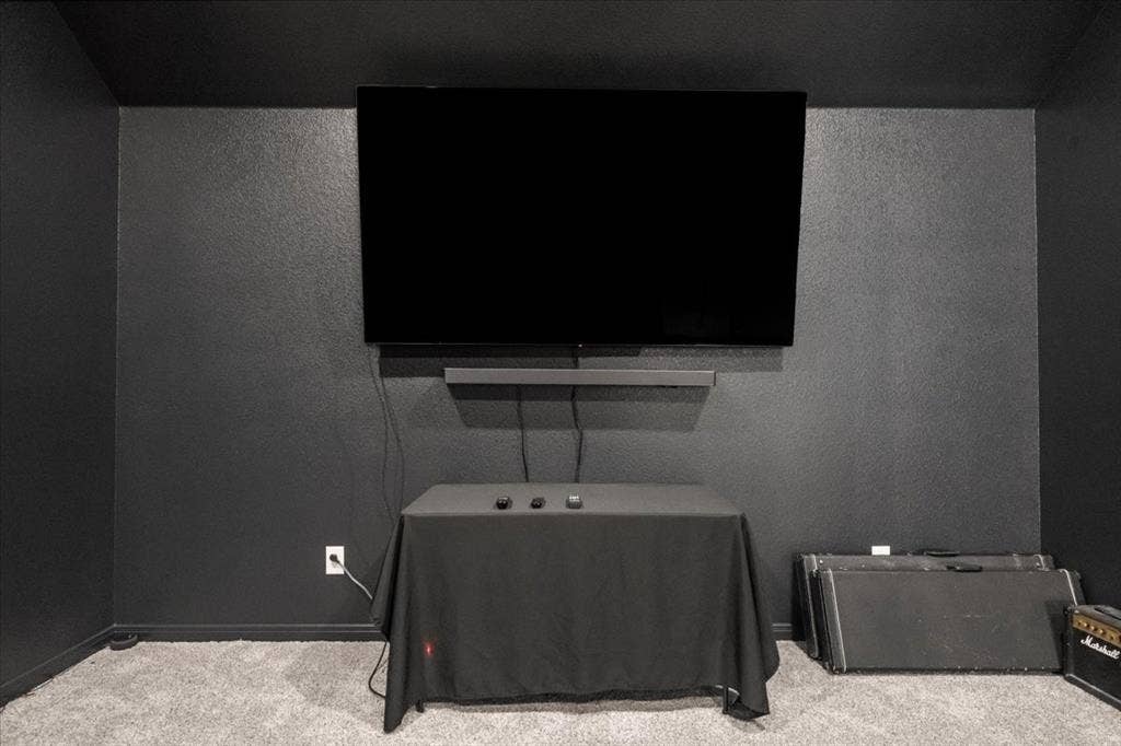 3501 Beutel Road, Waco, TX 76655 Cinema featuring carpet flooring and a textured wall