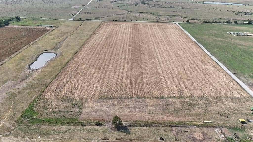 Aerial view of sparsely populated area featuring extensive farmland