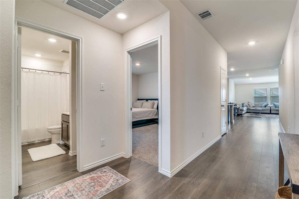Entry from front door.  2 bedrooms on left, living ahead.