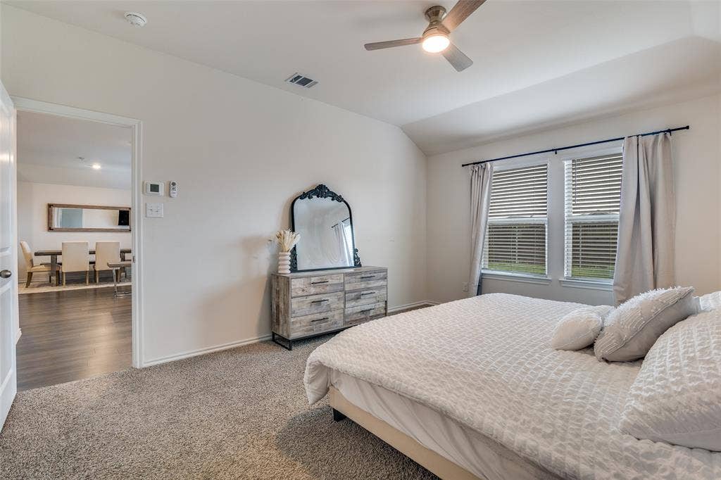 Primary, wonderful windows to back yard.