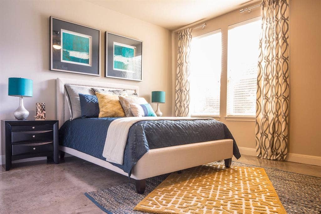 908 N Bishop Avenue, #2-103, Dallas, TX 75208 Bedroom featuring baseboards