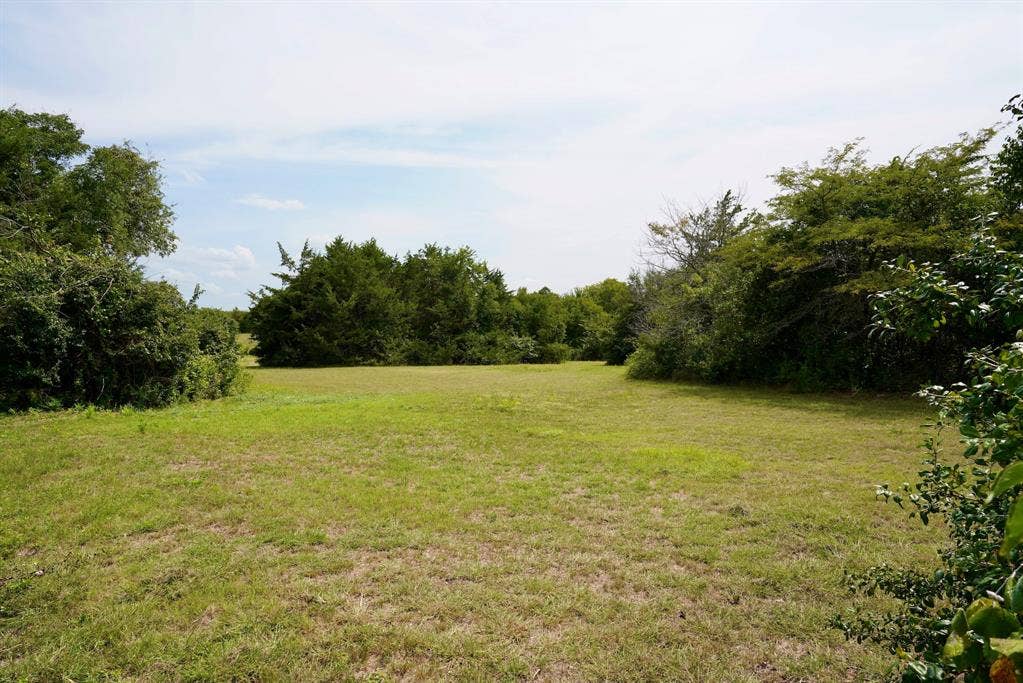 245 Oak Hill Court, Waxahachie, TX 75167 View of green lawn with a view of countryside
