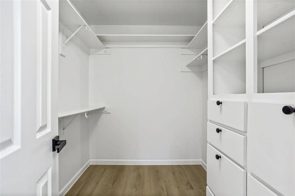 1 of 2 primary walk in closets