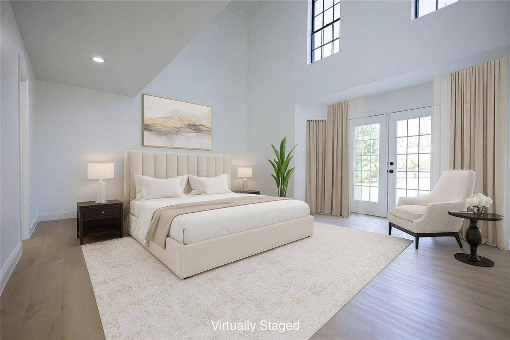 Primary suite with once again, soaring ceilings, it's own exterior door to the pool deck and so much natural lighting!!