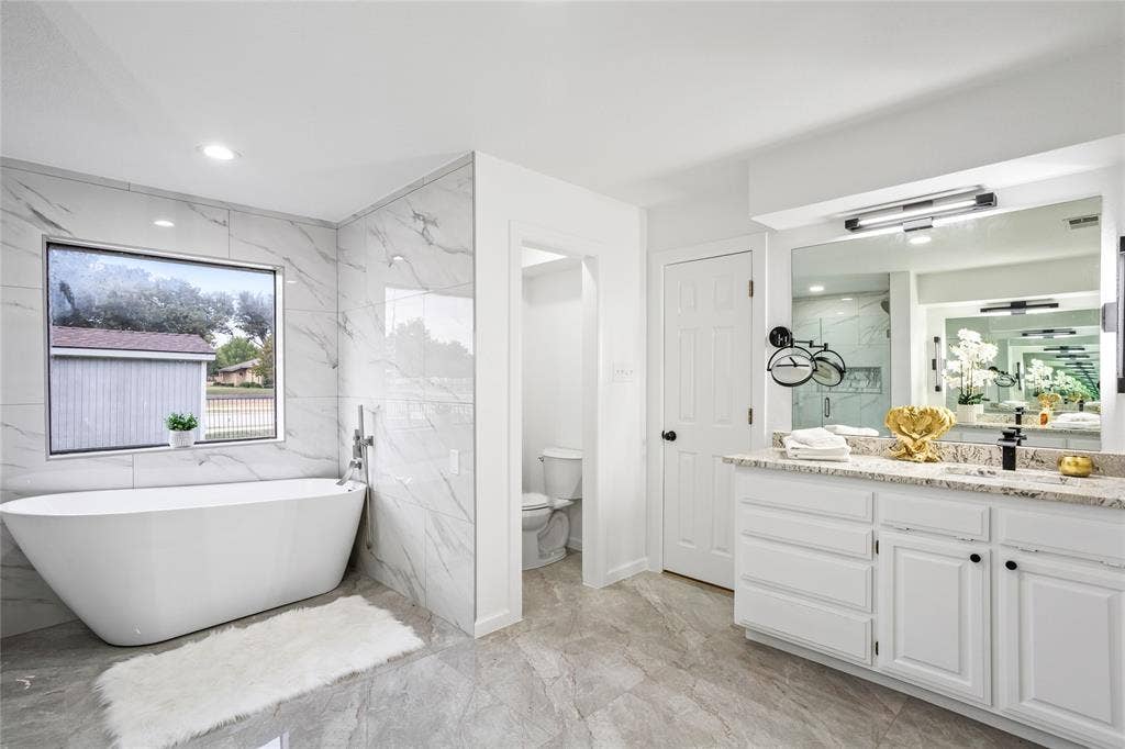 Double vanities across the room from each other - so spacious