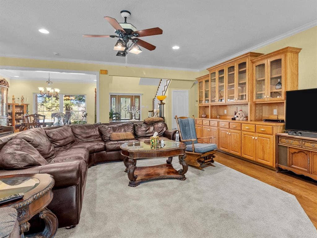 20941 Fm 16 W, Lindale, TX 75771 Living area featuring ornamental molding, light wood-style floors, a chandelier, ceiling fan, and recessed lighting