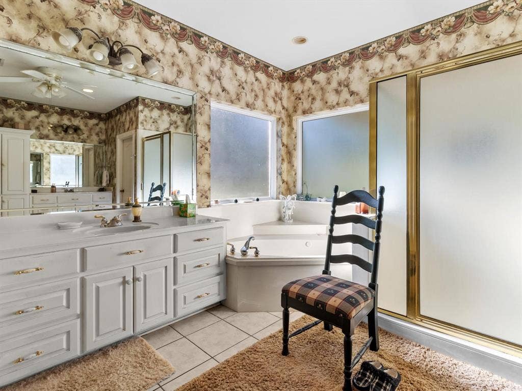 20941 Fm 16 W, Lindale, TX 75771 Full bath featuring vanity, a bath, light tile patterned flooring, a shower stall, and a ceiling fan