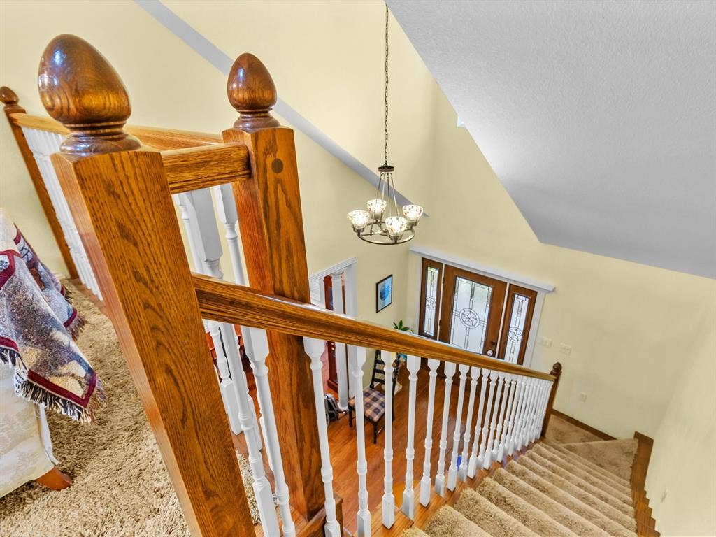 20941 Fm 16 W, Lindale, TX 75771 Stairway with a chandelier, carpet floors, and high vaulted ceiling