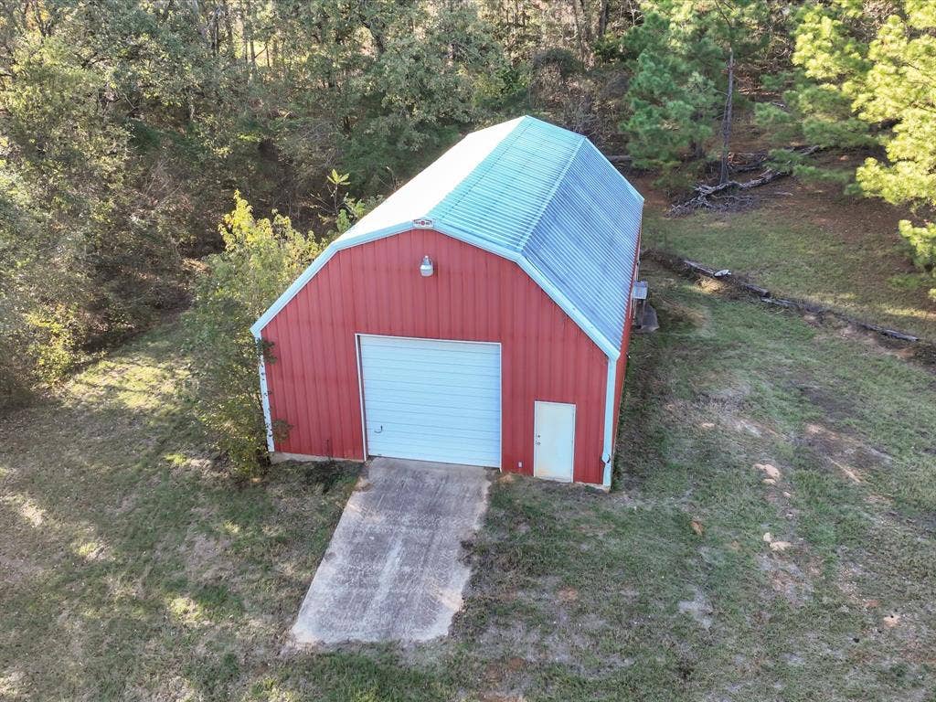 20941 Fm 16 W, Lindale, TX 75771 View of outbuilding with a wooded view