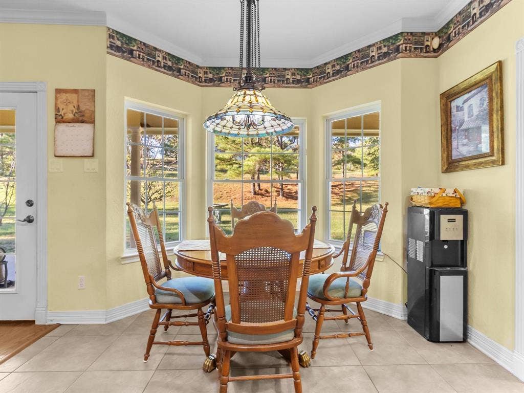 20941 Fm 16 W, Lindale, TX 75771 Dining room featuring crown molding and light tile patterned flooring