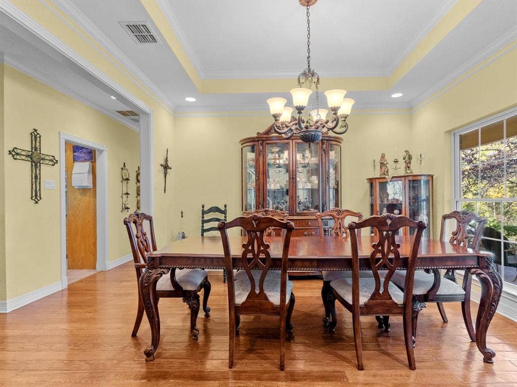 20941 Fm 16 W, Lindale, TX 75771 Dining room with a tray ceiling, a chandelier, light wood-style floors, recessed lighting, and ornamental molding