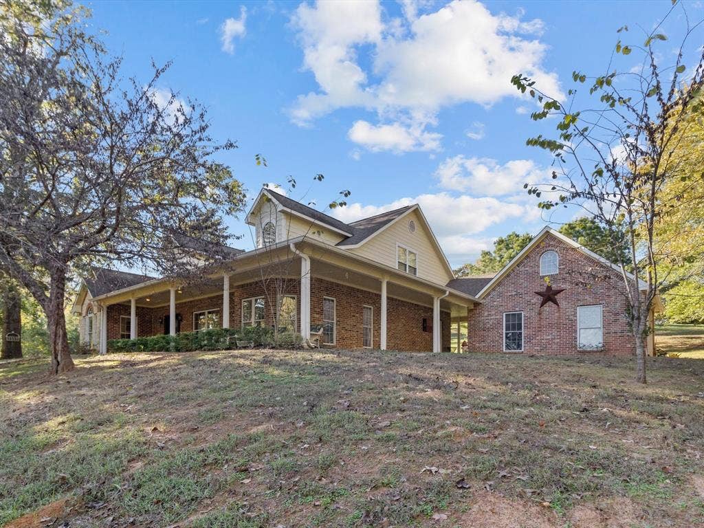 20941 Fm 16 W, Lindale, TX 75771 View of front of house featuring brick siding and a porch