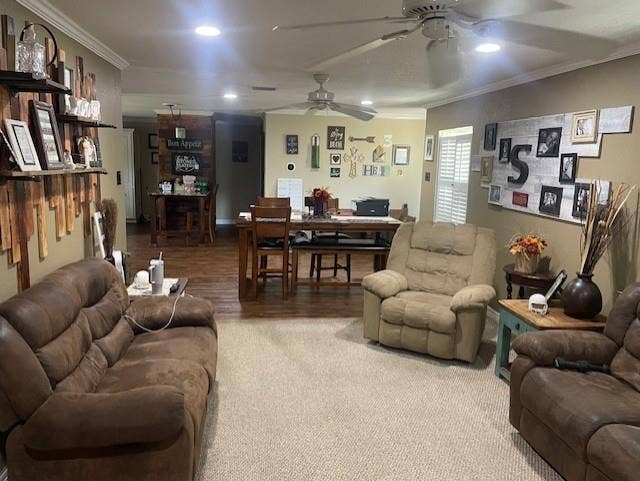 Living room with crown molding, recessed lighting, carpet flooring, and ceiling fan