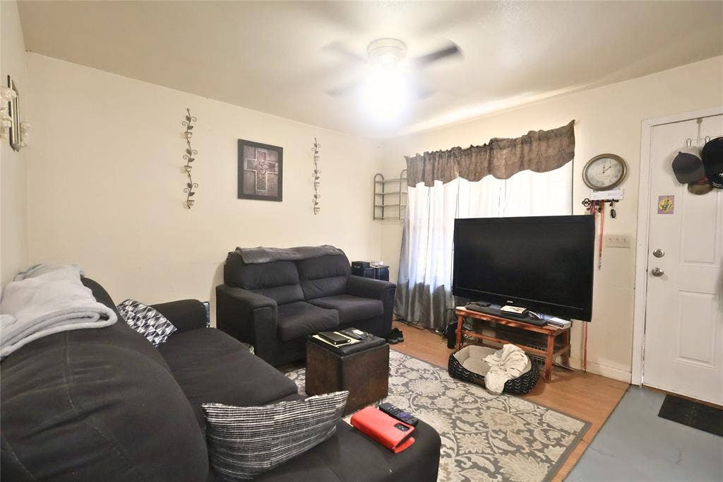 14186 Austin Street, Log Cabin, TX 75148 Living area with wood finished floors and a ceiling fan