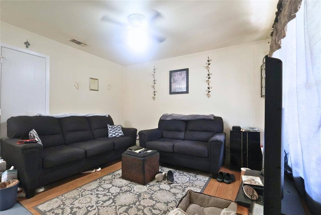 14186 Austin Street, Log Cabin, TX 75148 Living room featuring wood finished floors and ceiling fan