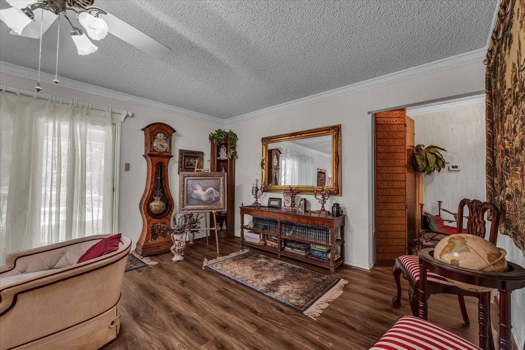 3405 Edna Avenue, Waco, TX 76708 Sitting room with crown molding, dark wood-style flooring, a textured ceiling, and a ceiling fan