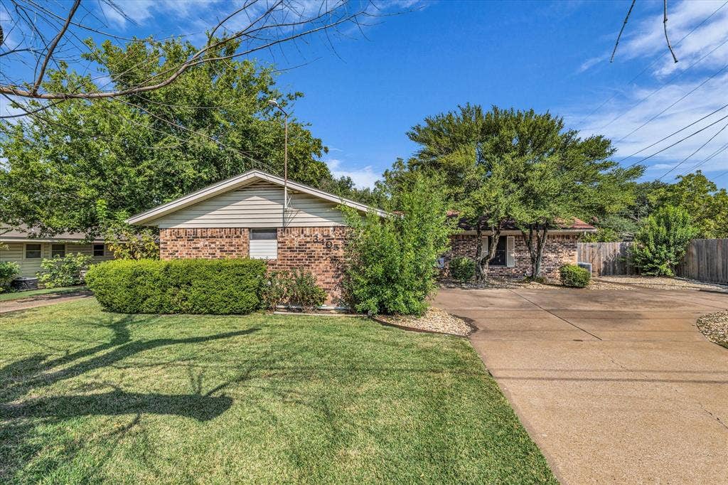 3405 Edna Avenue, Waco, TX 76708 View of home's exterior with brick siding