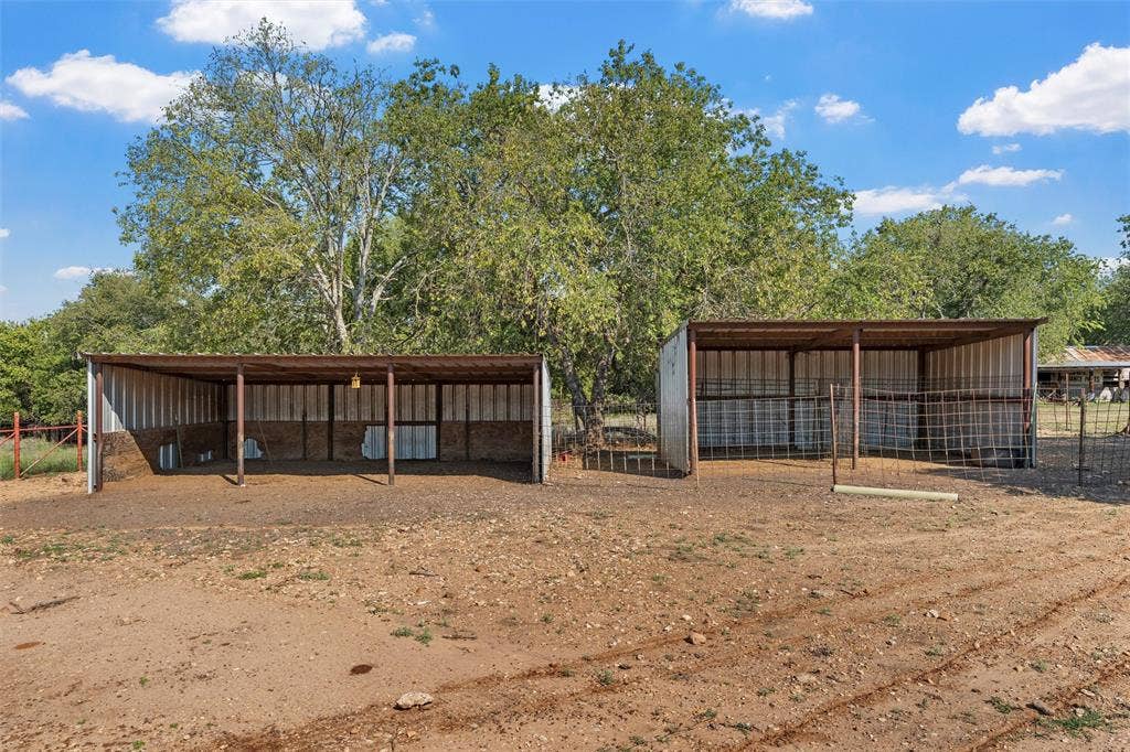 12145 Tree Lake Drive, Waco, TX 76708 View of yard featuring an outdoor structure, an outbuilding, and a carport