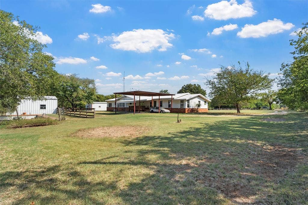12145 Tree Lake Drive, Waco, TX 76708 View of yard with an outdoor structure
