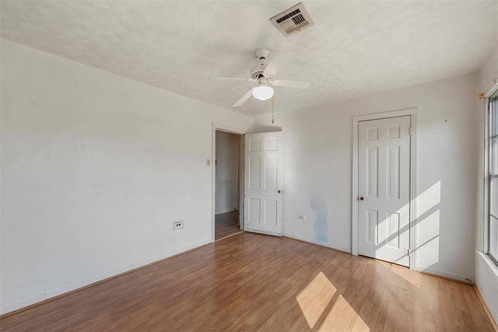 12145 Tree Lake Drive, Waco, TX 76708 Unfurnished bedroom featuring light wood-style flooring, ceiling fan, and a closet