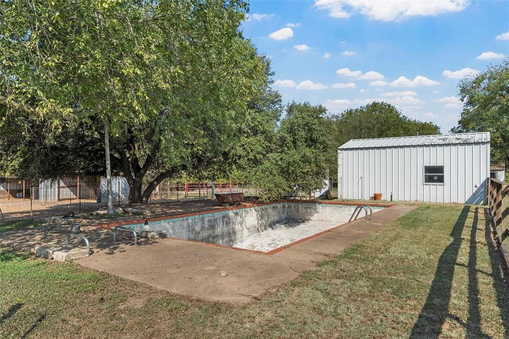 12145 Tree Lake Drive, Waco, TX 76708 View of pool with a patio and an outdoor structure