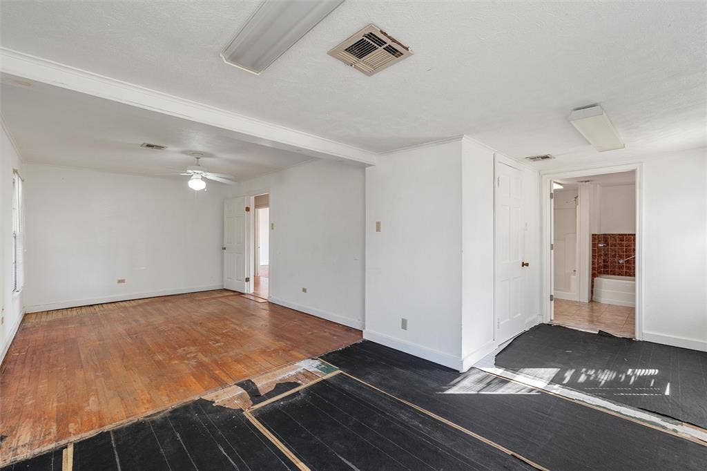 12145 Tree Lake Drive, Waco, TX 76708 Unfurnished living room featuring wood-type flooring and ceiling fan