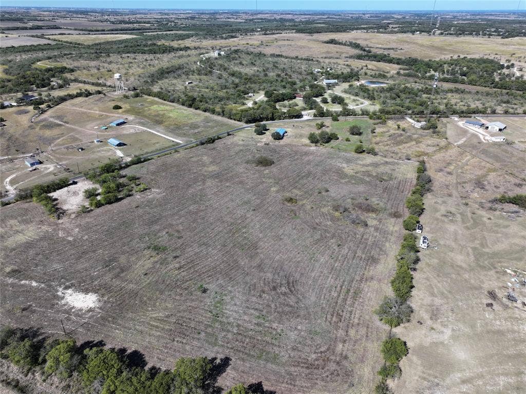 Aerial view of property's location with rural landscape