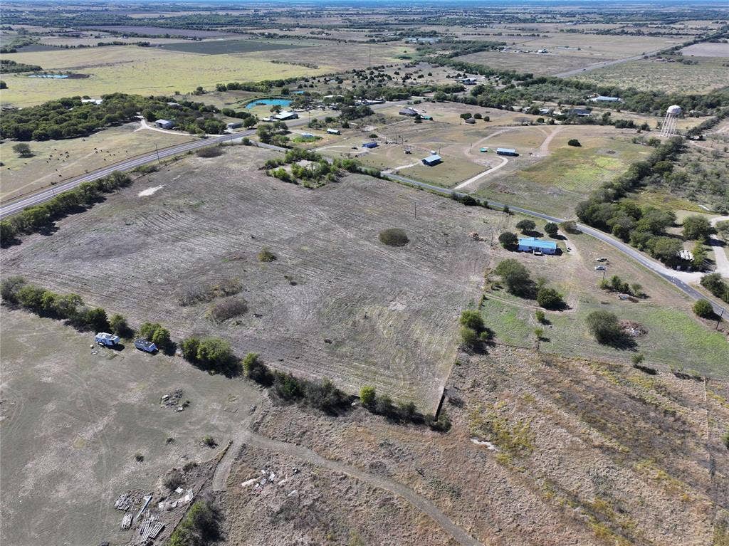 Aerial view of property and surrounding area with rural landscape