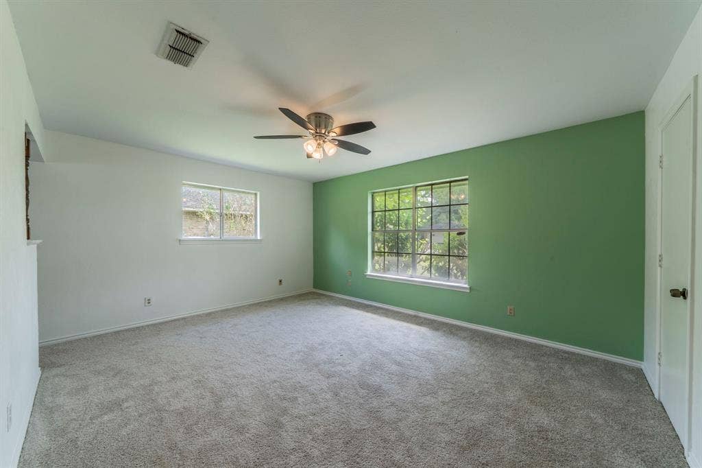 105 Briar Lane, Waxahachie, TX 75165 Empty room with carpet and ceiling fan