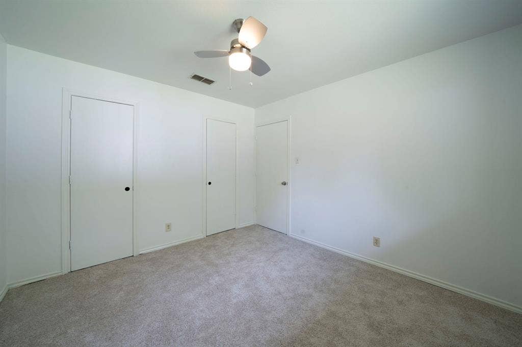 105 Briar Lane, Waxahachie, TX 75165 Unfurnished bedroom with carpet floors and a ceiling fan