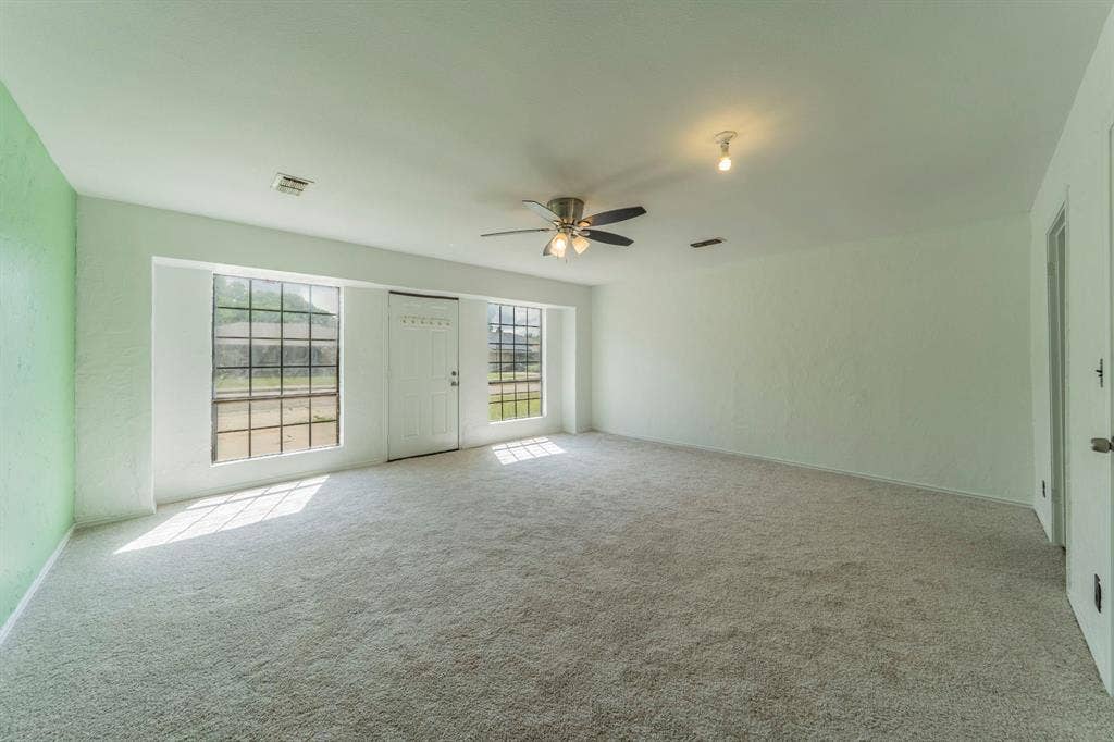 105 Briar Lane, Waxahachie, TX 75165 Empty room featuring light carpet and ceiling fan