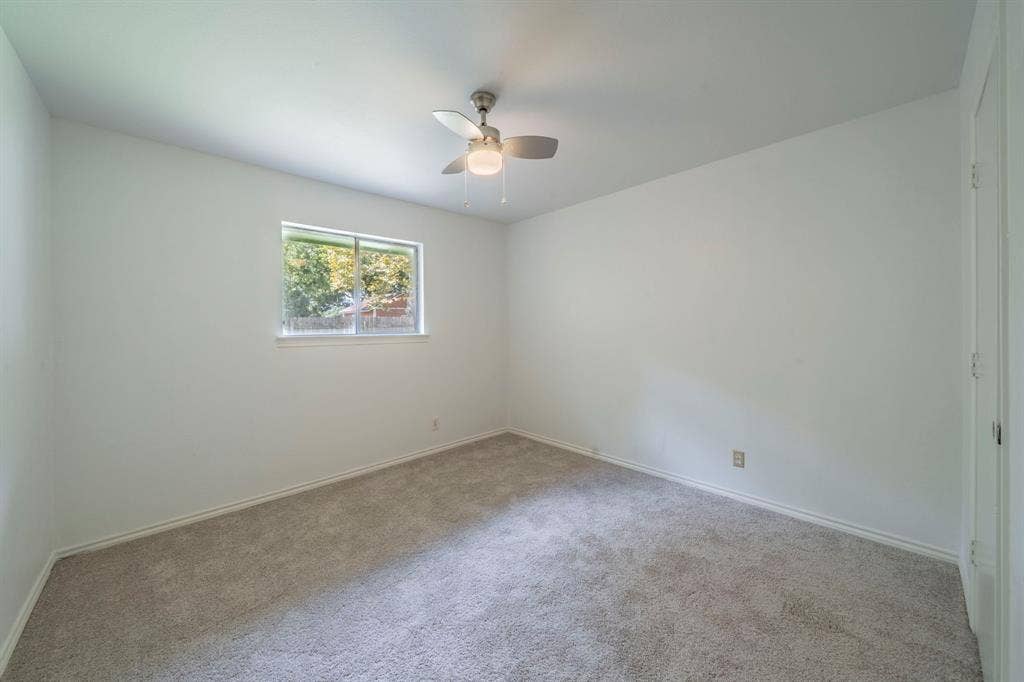 105 Briar Lane, Waxahachie, TX 75165 Empty room with carpet flooring and ceiling fan