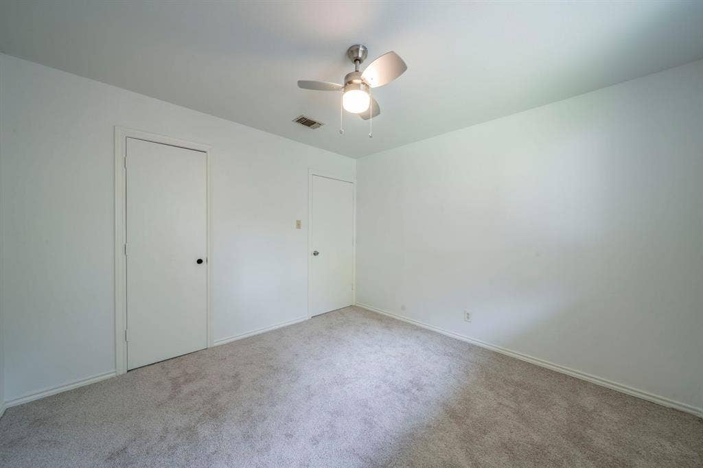 105 Briar Lane, Waxahachie, TX 75165 Unfurnished bedroom with carpet flooring, ceiling fan, and a closet