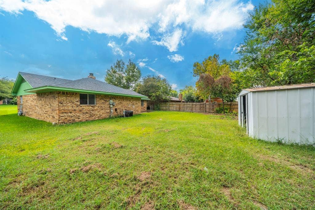 105 Briar Lane, Waxahachie, TX 75165 View of yard featuring a shed