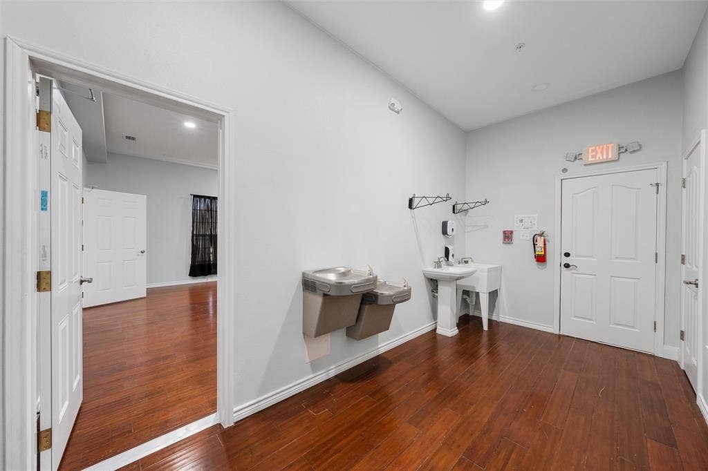 Bathroom featuring dark wood-style floors and recessed lighting