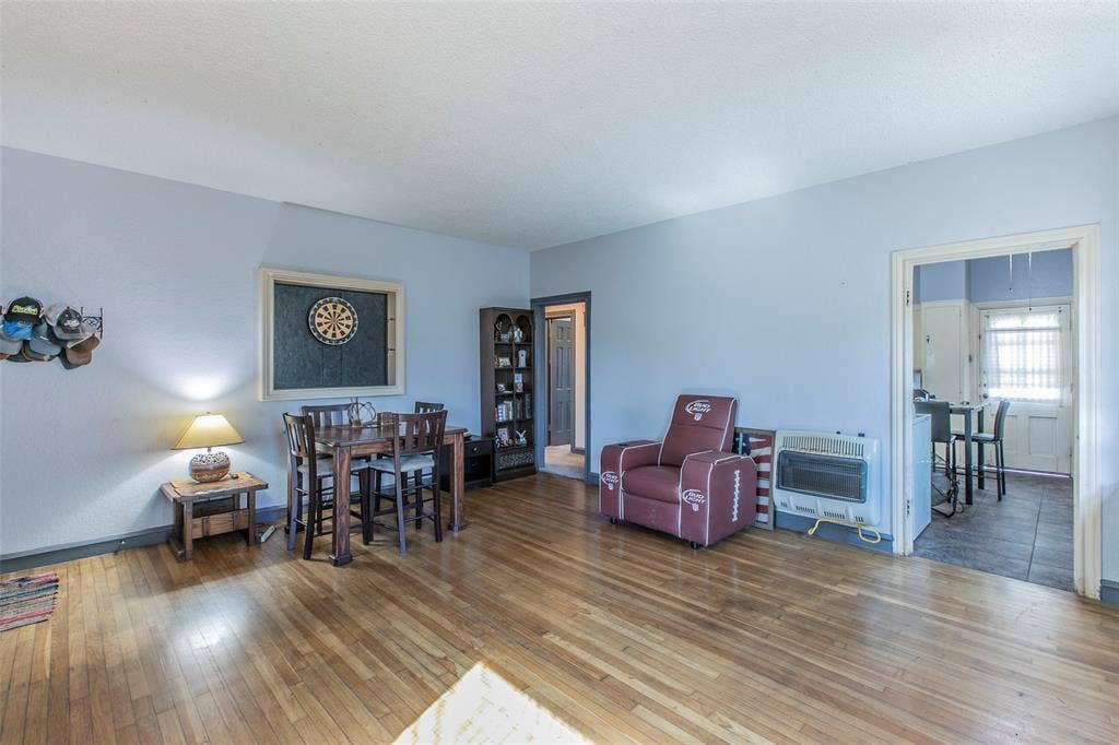 2603 Pine Avenue, Waco, TX 76708 Living room with heating unit and hardwood / wood-style floors