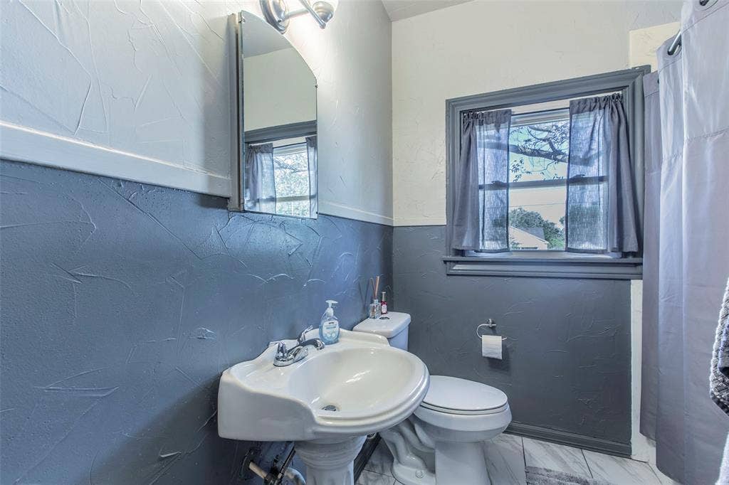 2603 Pine Avenue, Waco, TX 76708 Bathroom with toilet and a textured wall