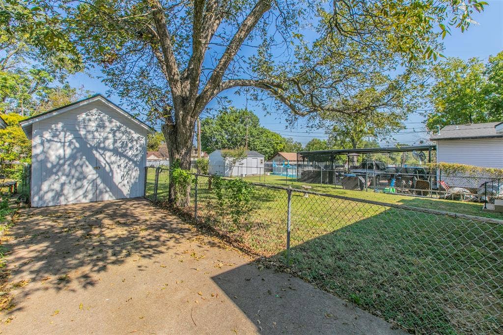 2603 Pine Avenue, Waco, TX 76708 Fenced backyard featuring a storage shed