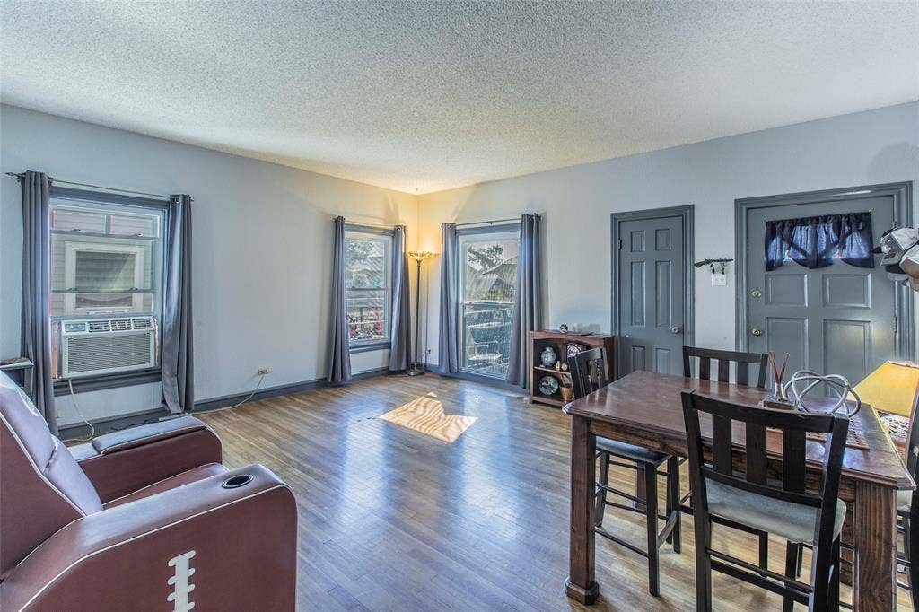 2603 Pine Avenue, Waco, TX 76708 Living area featuring a textured ceiling and wood finished floors