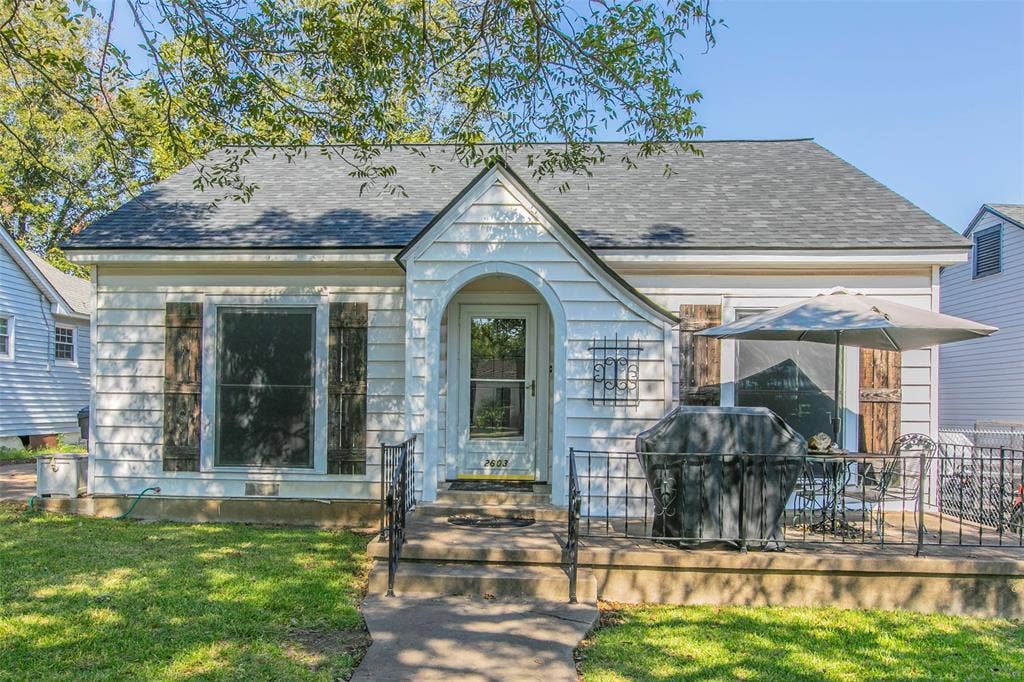 2603 Pine Avenue, Waco, TX 76708 View of front of home with a shingled roof and a front lawn